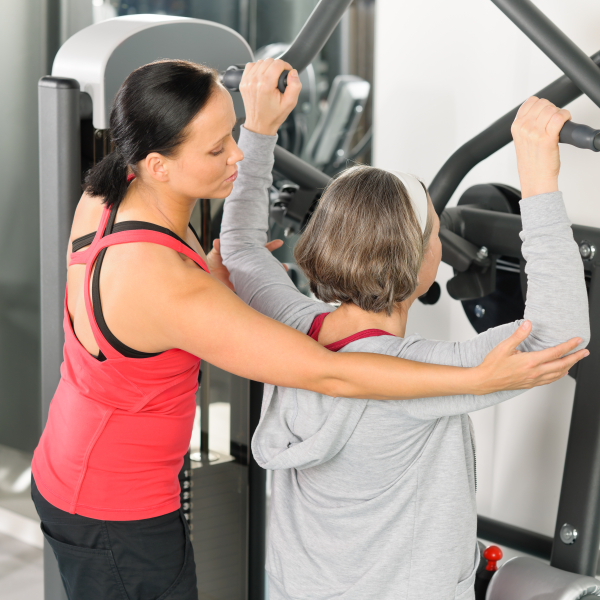 Trainerin mit Frau, Shutterstock_96188609